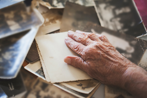 Memory-Care-Resident-Looking-at-Old-Photos