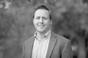 Headshot in black and white of Owen Hammond, Cascadia Healthcare CEO, Principal